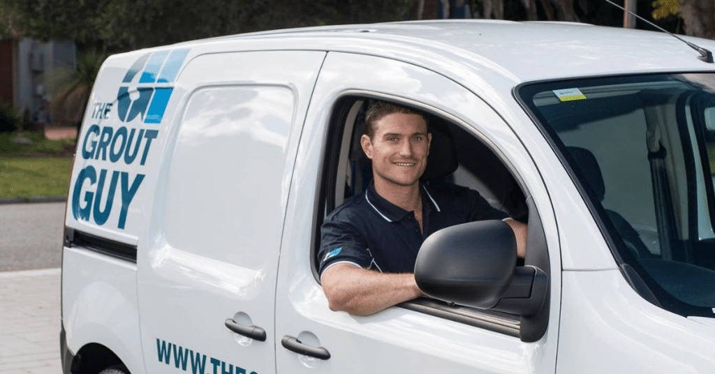 a specialist from the Grout Guy in company van