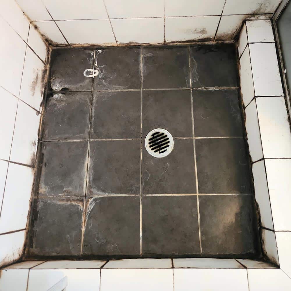 Grey and White Tiles Shower Floor Before
