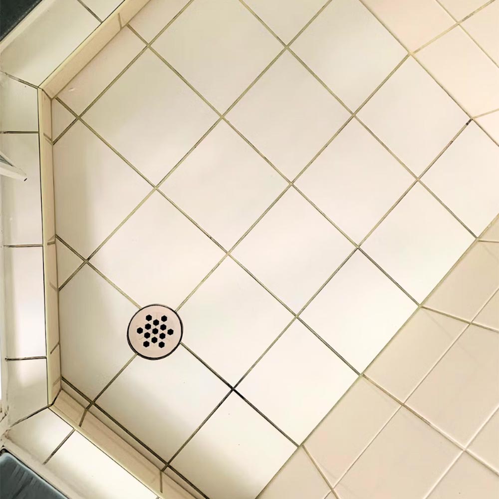 White tiles shower floor before